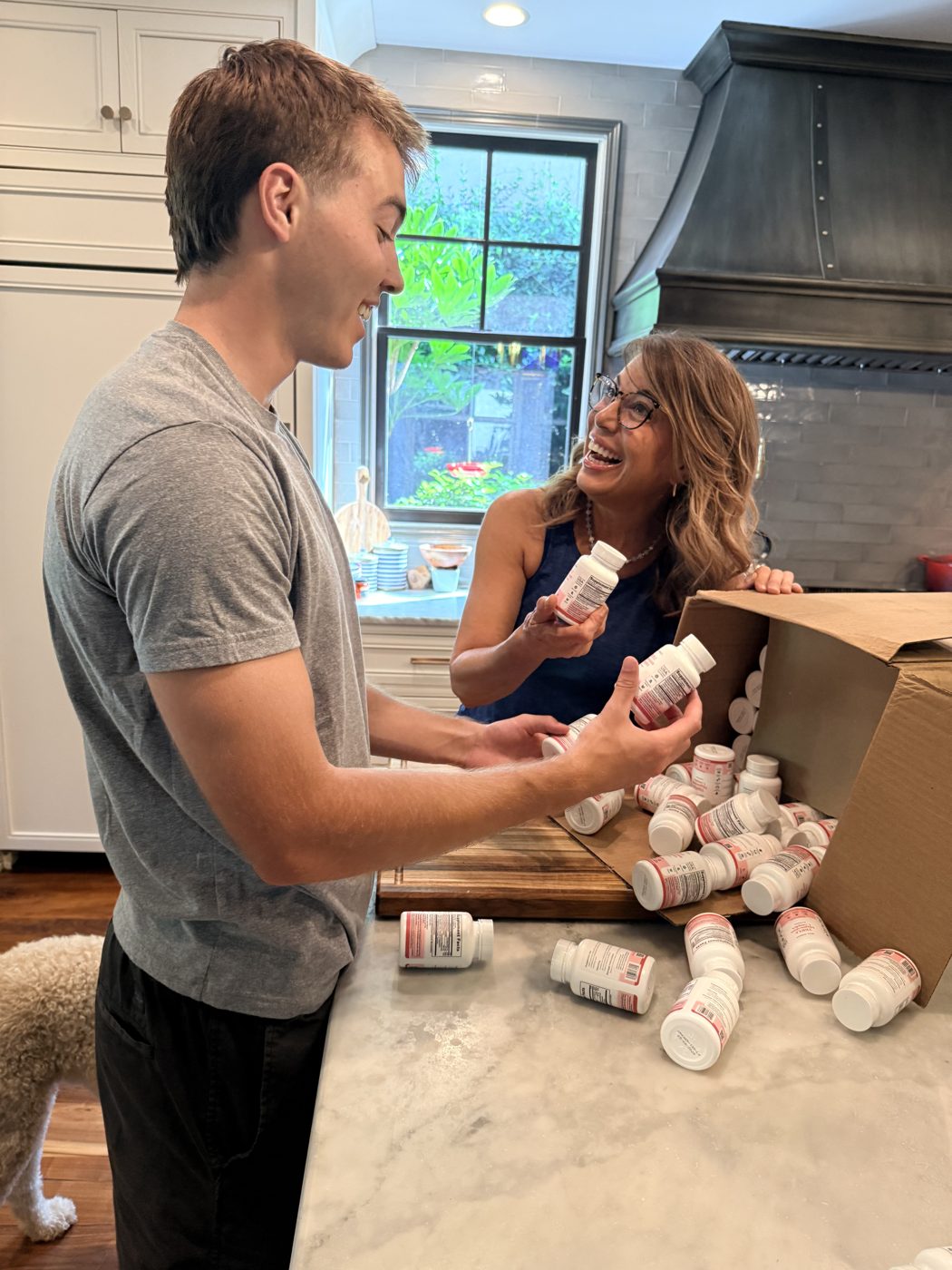 Zach and his mom Lola unboxing the first batch of Alora Balance bottles.